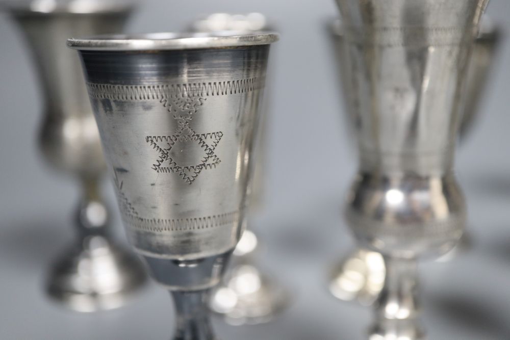 Eleven assorted mainly early 20th century silver kiddush cups and two similar Russian cups, gross 11.25oz.